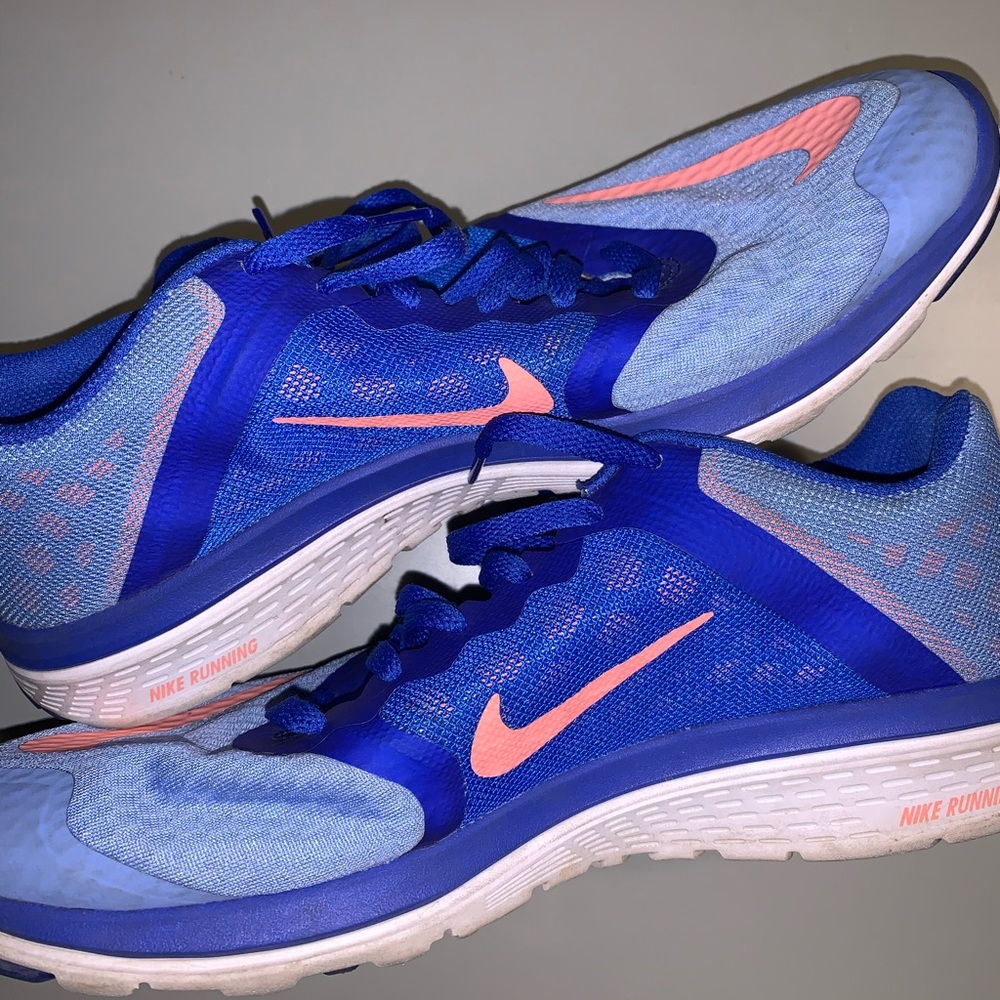 Blue and peach Nike shoes